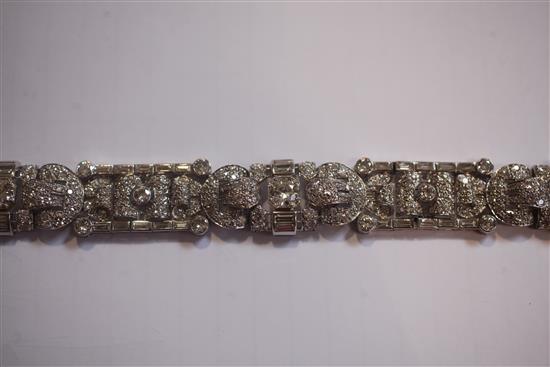An attractive 1930s/1940s Art Deco white gold and diamond encrusted bracelet in Jays of London fitted box, 7in.